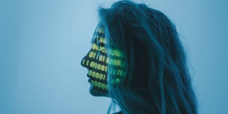 Silhouette of a woman with binary code projected on her face in a digital concept setting.